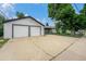 Exterior view of a two car garage, and backyard at 1001 Victor St, Aurora, CO 80011