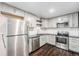 Well-equipped kitchen featuring stainless steel appliances, modern cabinets, and plenty of counter space at 1001 Victor St, Aurora, CO 80011
