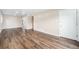 Inviting living area featuring wood-look floors, neutral paint, and ample space for furnishings at 1001 Victor St, Aurora, CO 80011