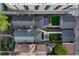 Aerial view of homes with well-maintained yards, including a patio with a shade structure and outdoor seating at 1729 N Clarkson St, Denver, CO 80218