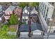 A captivating aerial view showing a charming house nestled among its neighbors and featuring two detached garages at 1729 N Clarkson St, Denver, CO 80218