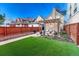 Spacious backyard with lush lawn, patio, and firepit seating, perfect for outdoor gatherings and leisure at 1729 N Clarkson St, Denver, CO 80218