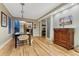 Bright dining area with hardwood floors that connects the kitchen and living room at 1729 N Clarkson St, Denver, CO 80218