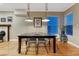 Comfortable dining area with hardwood floors, stylish lighting, and plenty of seating at 1729 N Clarkson St, Denver, CO 80218