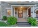 Inviting front porch with wooden floors, decorative pillars, and stylish seating area at 1729 N Clarkson St, Denver, CO 80218