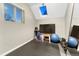 Bright workout room featuring a skylight, exercise equipment, and a large mirror for a great fitness space at 1729 N Clarkson St, Denver, CO 80218