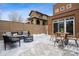 A covered back patio features outdoor furniture and provides an ideal spot for entertaining at 467 Harrison St, Denver, CO 80206