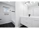 Modern bathroom with black and white tile, vanity, and bright lighting at 467 Harrison St, Denver, CO 80206