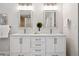 Bright bathroom features double sinks, modern fixtures, and ample counter space at 467 Harrison St, Denver, CO 80206