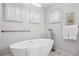 Bright bathroom featuring a modern soaking tub with natural light and clean, white accents at 467 Harrison St, Denver, CO 80206