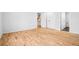 Empty bedroom with hardwood floors, white walls, and two closets at 467 Harrison St, Denver, CO 80206