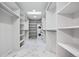 Large, bright walk-in closet with marble tile floors and open shelving at 467 Harrison St, Denver, CO 80206