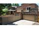 Exterior featuring a balcony, stone accents, garage and enclosed patio area at 467 Harrison St, Denver, CO 80206