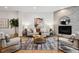 A comfortable living room shows a stone fireplace, decorative rug, and modern furniture at 467 Harrison St, Denver, CO 80206