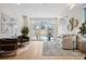Bright living room with modern furnishings, light hardwood floors, and access to outdoor patio at 467 Harrison St, Denver, CO 80206