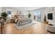 Spacious main bedroom features hardwood floors, a fireplace, and private balcony access at 467 Harrison St, Denver, CO 80206