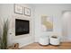 Main bedroom corner features a modern fireplace, hardwood floors, and stylish decor at 467 Harrison St, Denver, CO 80206