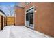 Private patio with sliding glass doors, concrete floor, and fenced perimeter to create a personal retreat at 467 Harrison St, Denver, CO 80206