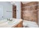 Bathroom featuring neutral tile, a shower-tub combo, and a light vanity with modern fixtures at 15501 E 112Th Ave # 15C, Commerce City, CO 80022