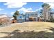 Backyard featuring a large grassy area, patio and a covered seating area at 7193 S Newport Way, Centennial, CO 80112