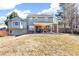 Lovely backyard featuring covered patio with chairs perfect for outdoor entertainment at 7193 S Newport Way, Centennial, CO 80112