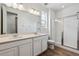 Main bathroom with double vanity and large shower at 9661 Ceylon St, Commerce City, CO 80022