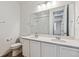 Bathroom with double vanity and mirror at 9661 Ceylon St, Commerce City, CO 80022