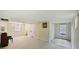 Open basement with a piano, a window, and access to the backyard at 321 S Gilpin St, Denver, CO 80209