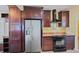 Modern kitchen features stainless steel appliances and abundant cabinet space at 321 S Gilpin St, Denver, CO 80209