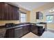 Kitchen showcases granite countertops, stainless steel appliances and dark wood cabinetry at 321 S Gilpin St, Denver, CO 80209