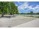 Lake scene featuring sandy areas, trees, a gazebo, and a building across the water at 321 S Gilpin St, Denver, CO 80209