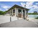 Pavilion with benches near the water, featuring stone architecture and lake views at 321 S Gilpin St, Denver, CO 80209