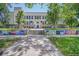 Exterior shot of school building featuring mural art near a lawn and entrance at 321 S Gilpin St, Denver, CO 80209