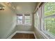 Bright sun room with lots of windows and hardwood floors at 321 S Gilpin St, Denver, CO 80209