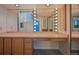 Vanity with cabinets, drawers, Hollywood lights and large mirrors, perfect for getting ready at 321 S Gilpin St, Denver, CO 80209