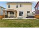Backyard with a patio, gazebo, dining set, hot tub, and grass at 5957 N Orleans St, Aurora, CO 80019