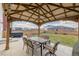 Backyard featuring a covered patio with dining set and a jacuzzi at 5957 N Orleans St, Aurora, CO 80019
