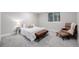 Comfortable bedroom with plush carpet, warm lighting, and neutral decor at 5957 N Orleans St, Aurora, CO 80019