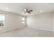 Spacious bedroom featuring plush carpeting and large windows with backyard views at 5957 N Orleans St, Aurora, CO 80019