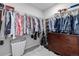 Large walk-in closet with ample hanging space and shelving at 5957 N Orleans St, Aurora, CO 80019