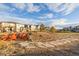 Community fire pit area with Adirondack chairs providing a gathering place for neighbors at 5957 N Orleans St, Aurora, CO 80019