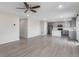 Open-concept living space featuring hard surface floors and neutral paint at 5957 N Orleans St, Aurora, CO 80019