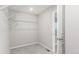 A walk-in closet featuring carpet and white wire shelving for organized storage at 5957 N Orleans St, Aurora, CO 80019