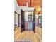 Charming bar nook features wooden cabinetry, built-in shelving, and a convenient mini-fridge at 994 Timber Ln, Boulder, CO 80304