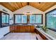 Bright bathroom with double vanity, wooden ceiling, and picturesque views from the soaking tub at 994 Timber Ln, Boulder, CO 80304
