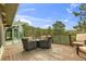 Spacious deck offering scenic views with comfortable wicker seating and an inviting fire pit at 994 Timber Ln, Boulder, CO 80304