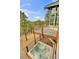 Relaxing deck with a hot tub and beautiful views of the mountains and forest at 994 Timber Ln, Boulder, CO 80304