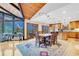 Elegant dining room with picturesque views, seamlessly connected to the kitchen and sun room at 994 Timber Ln, Boulder, CO 80304