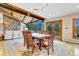 Inviting dining room with a large table, decorative rug, and mountain views, perfect for entertaining guests at 994 Timber Ln, Boulder, CO 80304
