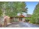 Exterior day view of the house with a front porch and landscaped entrance at 994 Timber Ln, Boulder, CO 80304